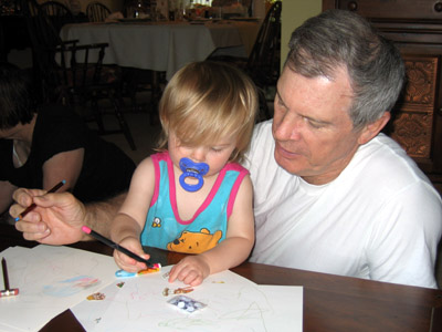 Grandpa Calvin draws and colors with granddaughters